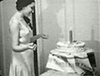 Clara Rockmore marvelling at her electric cake; from http://theremin.ru/.