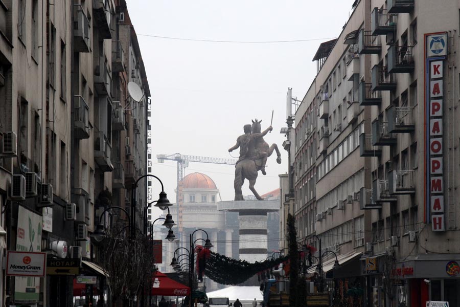 Warrior on a Horse monument in the city center of Skopje (front). The building of a New National Theatre (back). Photo taken: 25 December 2011. Image Courtesy of Petar Kajevski