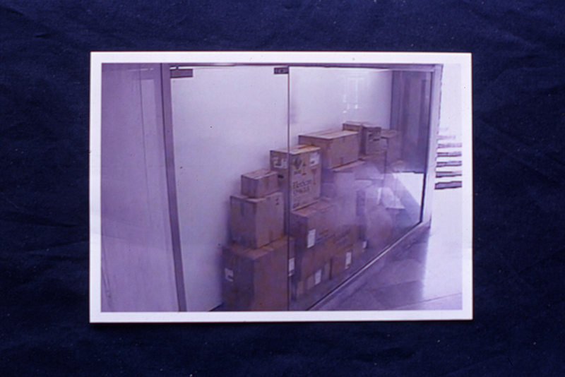 Miklós Erhardt, 'Retrospective', 2009, slide show with a photograph of Erhardt’s former (2008) work of art entitled 'Footnotes to Bare Life. 26 Cardboard Boxes That (Arguably) Contains all my Stuff to Date'. Image courtesy of the artist.
