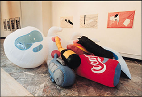 Katerina Vincourova,' Mother's Care', 2000, fabric, paint, inflatable toys (object/sculpture in the foreground). Emoke Vargova, Soft Pictures Series, 1999, embroidered textile (wall pieces in the background).