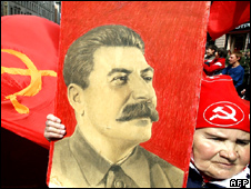 Woman carrying a portrait of Stalin at a 2005 Victory Day parade in Ekaterinburg, Russia. Image courtesy of Associated Press.