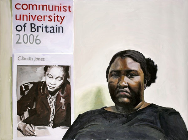 Portrait of a Black woman seated next to a poster that states "Communist University of Britain 2006" and contains a picture of Claudia Jones